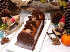 Recette Bûche agrumes, noisettes, chocolat au lait d'après Aurélien Trottier : croustillant noisettes, biscuit noisettes, crémeux aux agrumes, mousse chocolat au lait noisettes, chantilly chocolat au lait