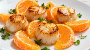 Recette Cette idée d’entrée mêlant Saint-Jacques et clémentines surprend autant qu’elle séduit