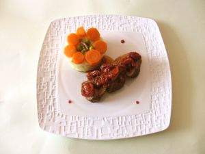 Recette Filet mignon de porc au miel, vin rouge et tomates cerises